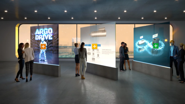 DXP Showroom ebm-papst Das Bild zeigt einen Ausschnitt der Digital Experience Platform für ebm-papst. Zu sehen ist ein virtueller Ausstellungsraum. Zentrum des Ausstellungsraums sind drei interaktive Hologramme, die für Nutzende der Experience Platform Informationen zu den Produkten und Leistungen von ebm-papst liefern und außerdem klickbar sind. Letzteres ist durch kleine klickbare Kreuze gekennzeichnet, die sich auf den Hologrammen befinden. Um das Feeling einer virtuellen Ausstellung abzurunden, stehen virtuelle Personen um die Hologramme verteilt und sehen sich diese genauer an.